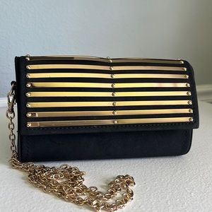 - Gianni Bini black and Gold crossbody Clutch